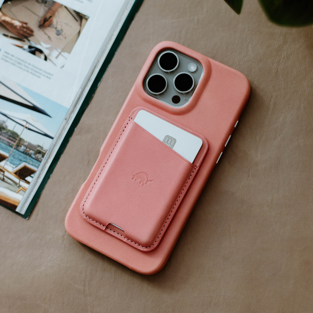 Leather magnetic wallet in pink color with card holder attached to a phone