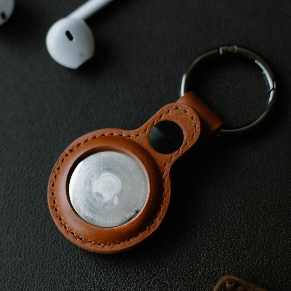 Brown leather BullTag holder for AirTag with a stainless-steel clip