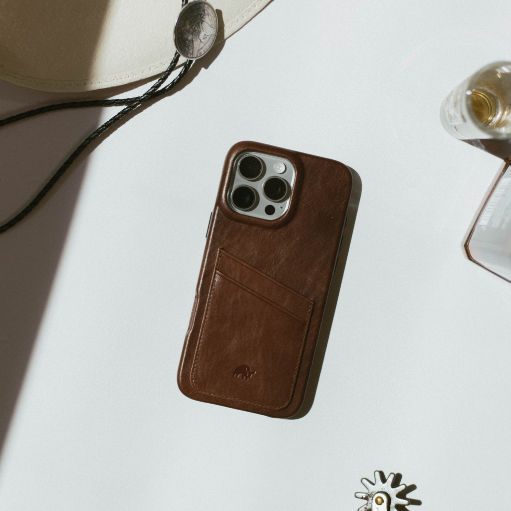 Brown leather phone case with two staggered card slots and small embossed logo