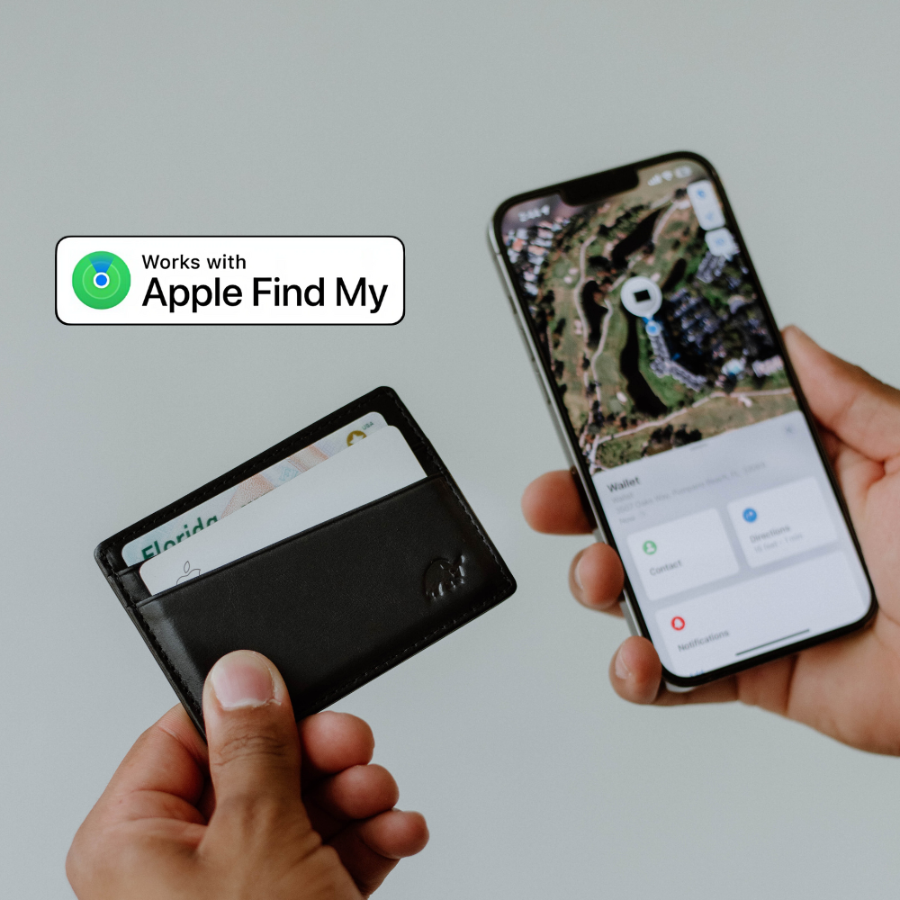 Hand holding cardholder and iPhone showing 'Wallet' app with 'Contact', 'Directions', 'Notifications'; badge 'Works with Apple Find My'; card shows 'Florida'.