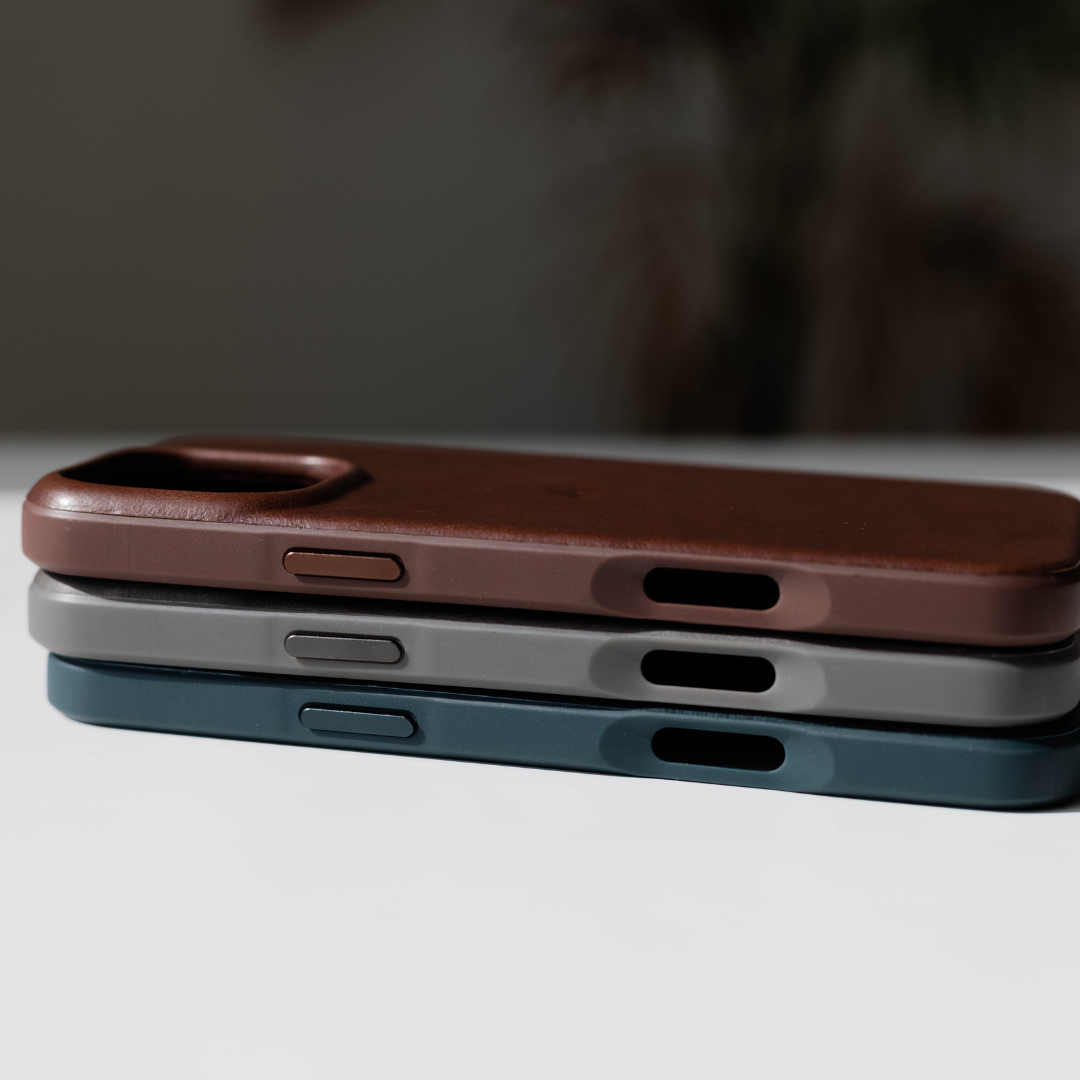 Three Flex Cases in Slate, Brown, and Gray stacked on a table
