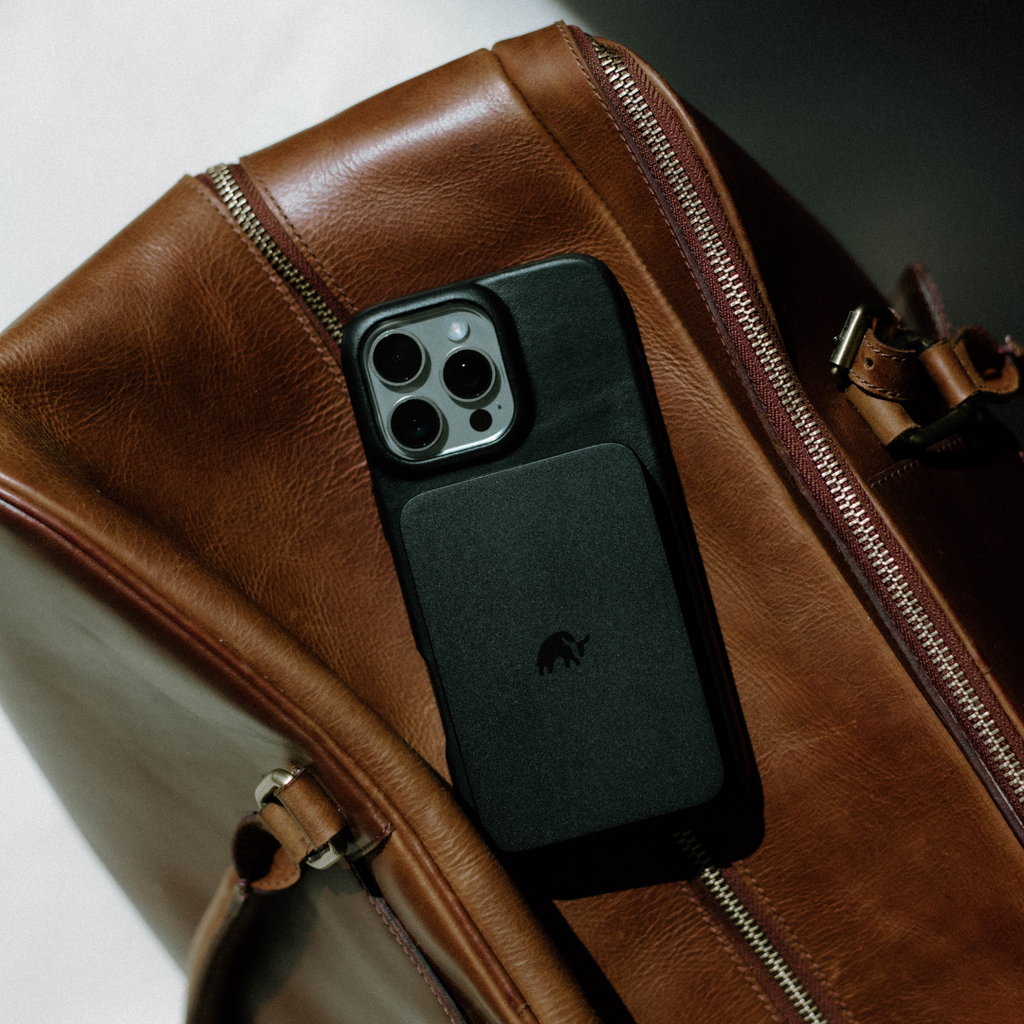 Black MagSafe Power Bank on a brown leather bag