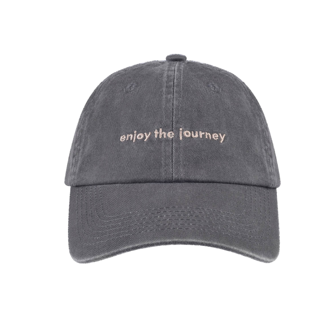Grey dad hat with 'enjoy the journey' text on the front