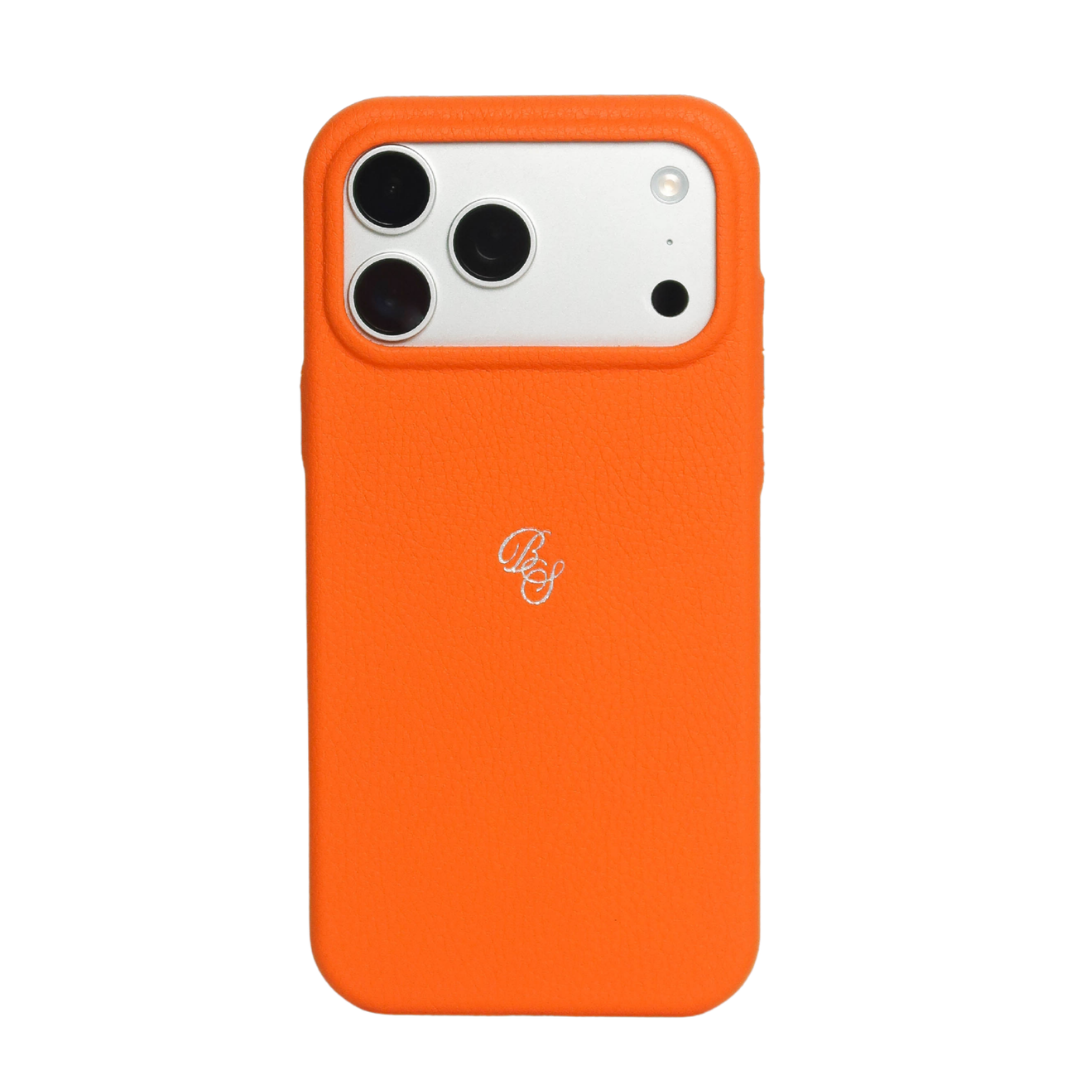 Rear view of Performance Case in Blaze orange leather with textured finish, raised camera lip and silver monogram