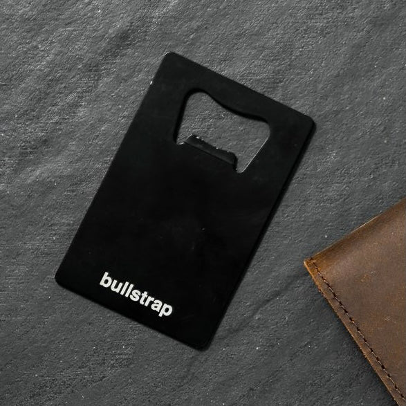 Black bottle opener card with 'bullstrap' text