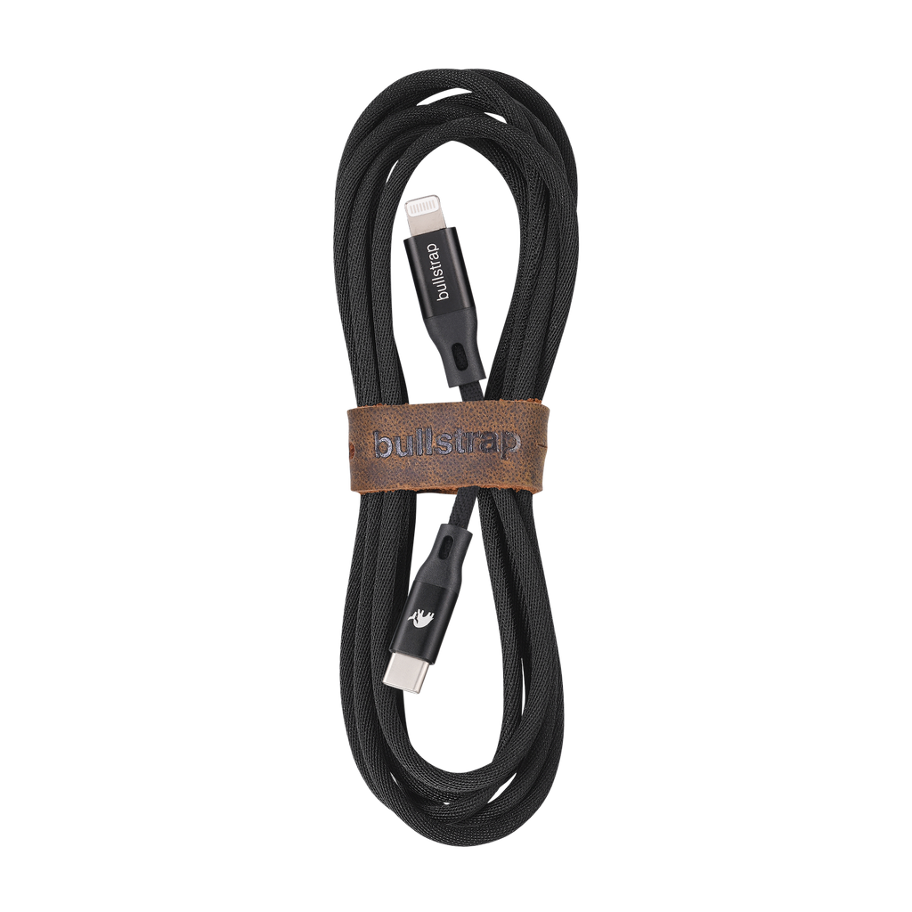 Black charging cable with USB-C to Lightning connector, featuring a leather cable-management loop.