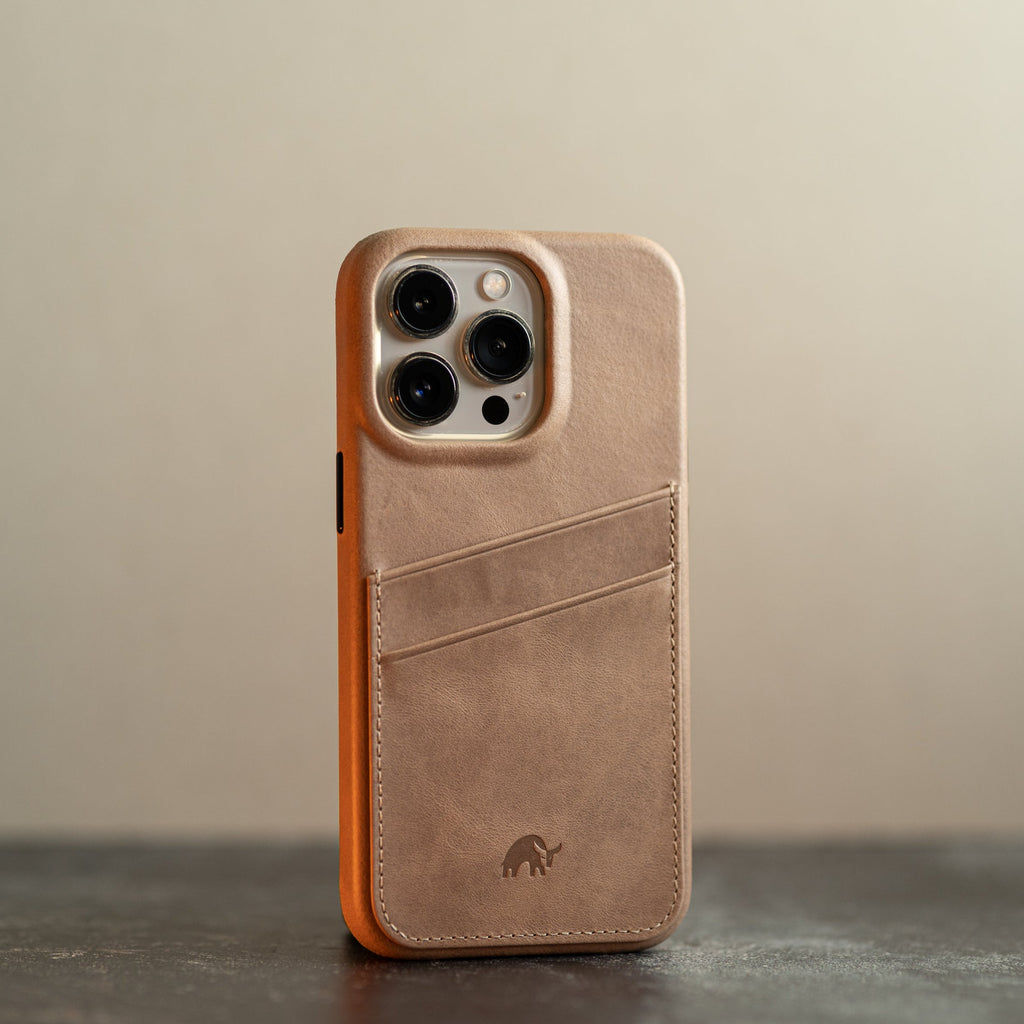 The Minimalist Portfolio Case in DUNE color, featuring card slots and a camera cutout.