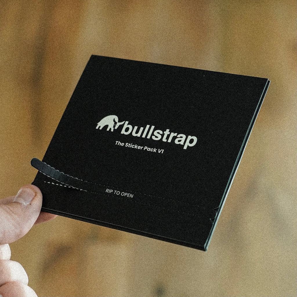 Black packaging of The Sticker Pack V1 with 'bullstrap' logo and 'RIP TO OPEN' text