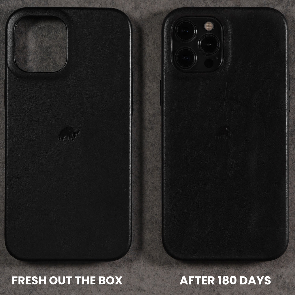 Two black leather iPhone cases side-by-side, left pristine with 'FRESH OUT THE BOX', right worn with 'AFTER 180 DAYS'.