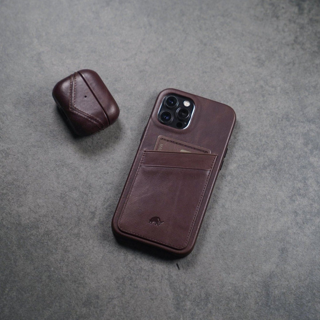 Leather AirPods case in bourbon color with a phone case, showing card slot and AirPods case.