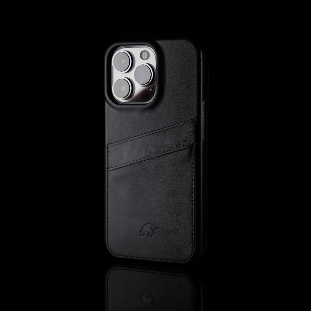 Black leather iPhone case with card slot, featuring a minimalist design