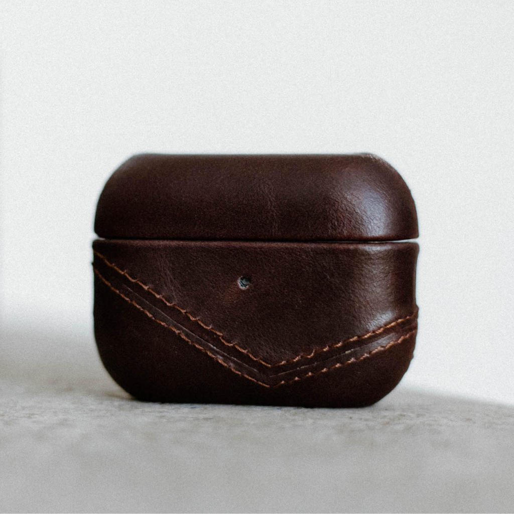 Brown leather AirPods case with stitching detail