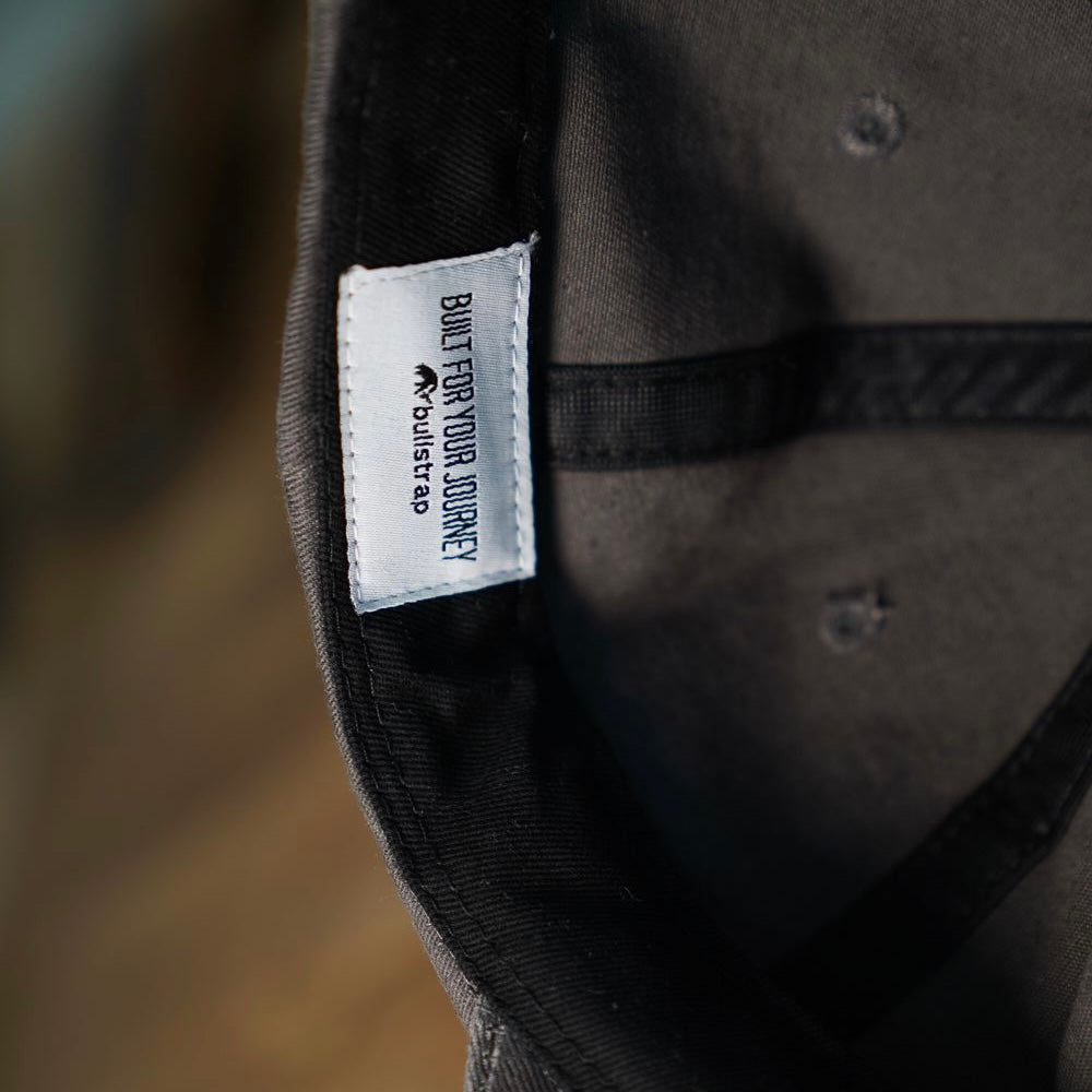 Inside view of Journey Dad Hat showing label 'BUILT FOR YOUR JOURNEY'