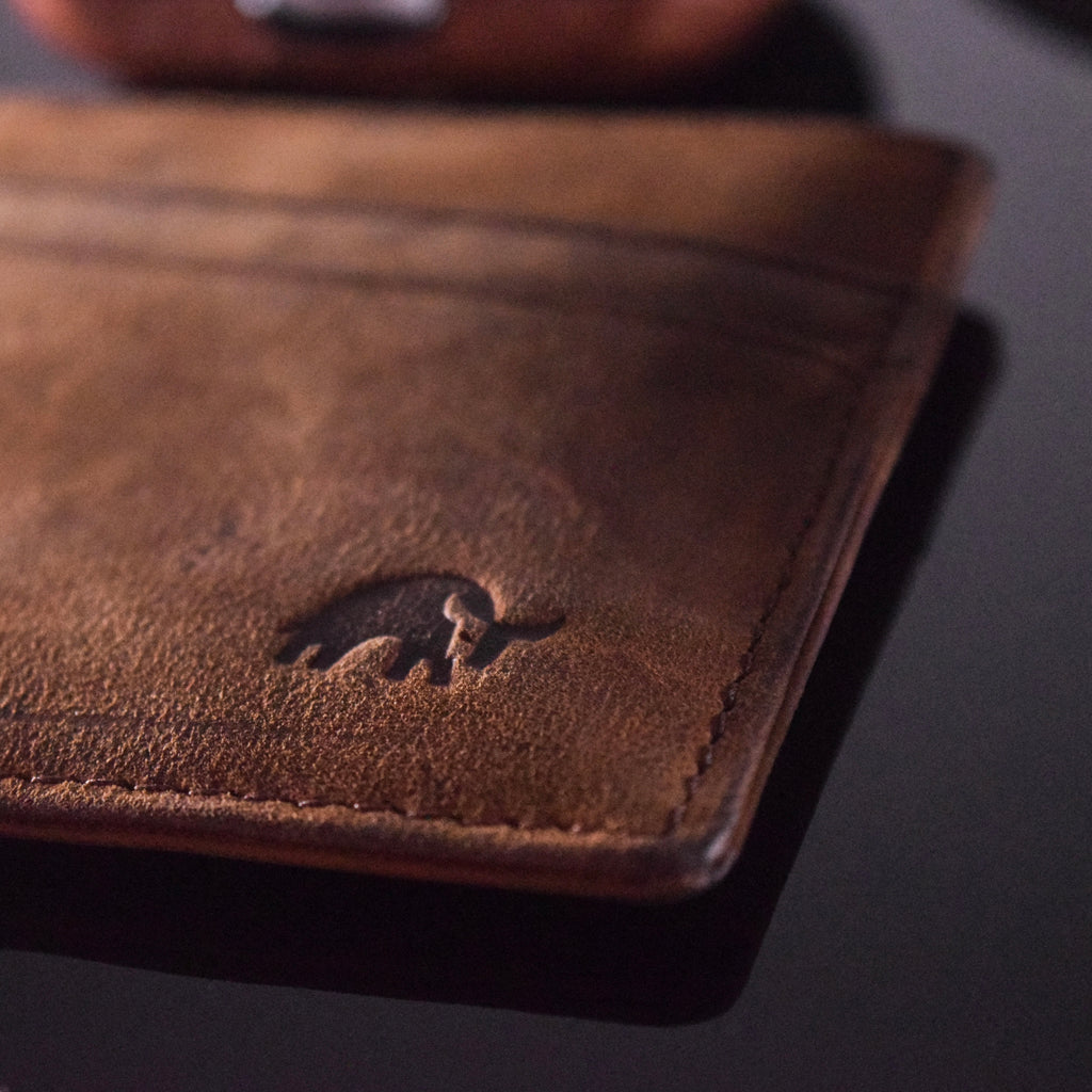Close-up of the Terra Card Holder showing embossed logo and leather texture