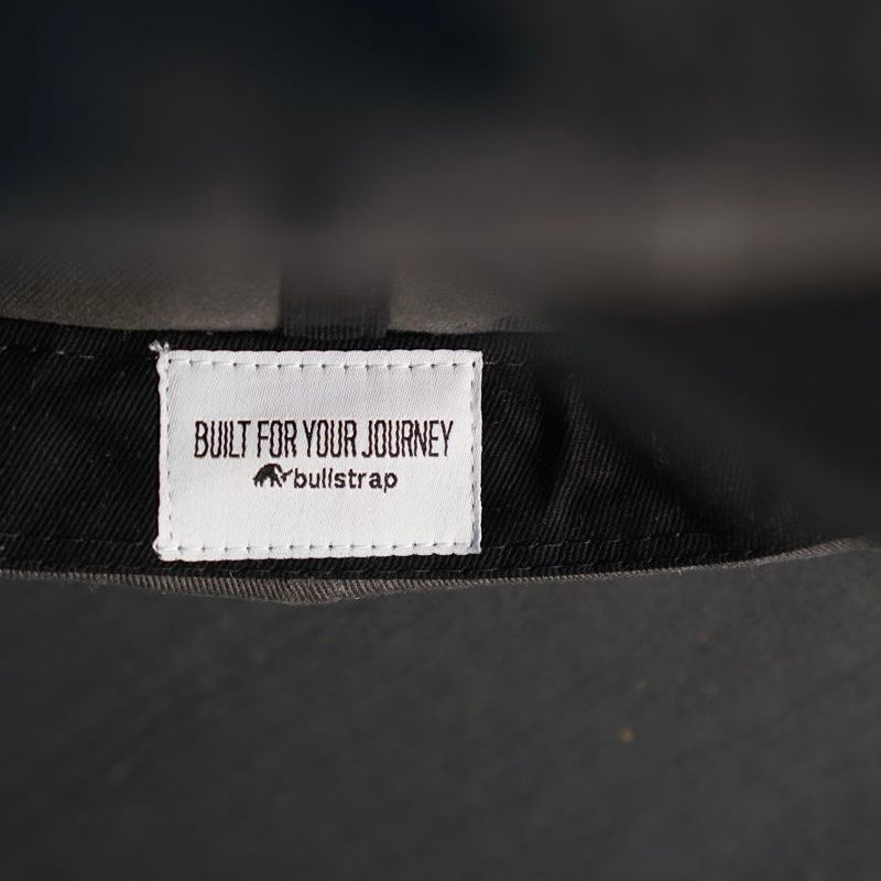 Label inside Journey Dad Hat showing 'BUILT FOR YOUR JOURNEY' and 'bullstrap'