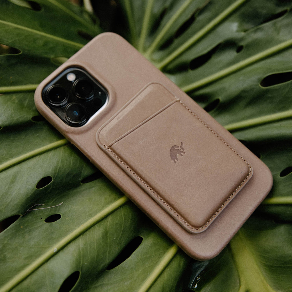 Leather Magnetic Wallet in Dune color on a leaf background